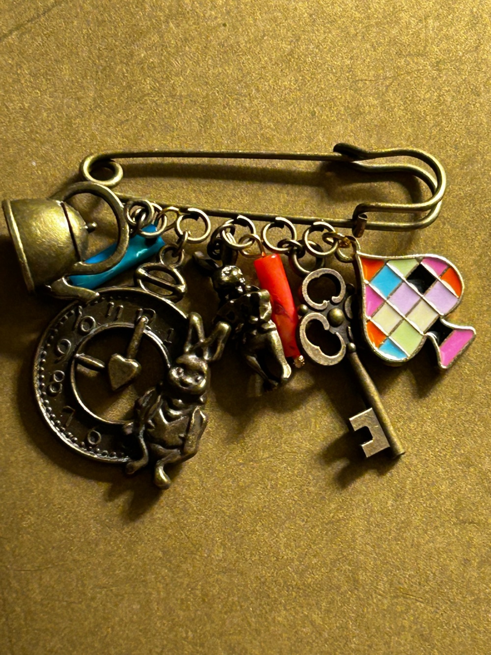 NWOT Safety Pin Brooch Alice in wonderland rabbits, teapot, key, clock charms
